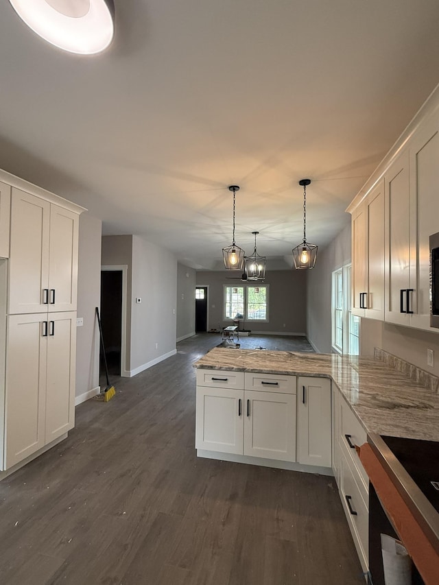 1522 2nd St, Waynesboro, VA 22980 - kitchen featuring a peninsula, white cabinetry, open floor plan, and dark wood-style flooring