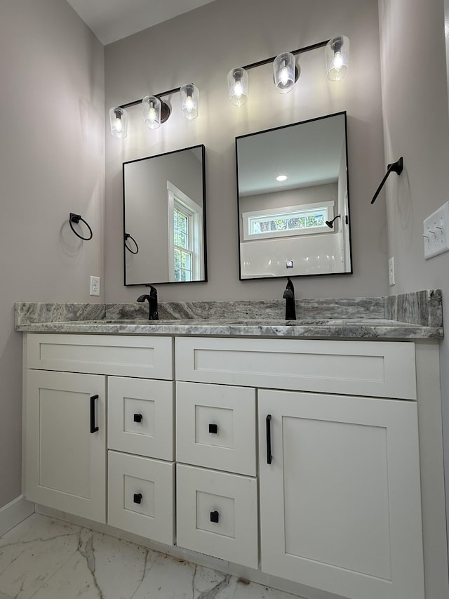 1522 2nd St, Waynesboro, VA 22980 - full bathroom featuring marble look tile flooring, double vanity, and plenty of natural light