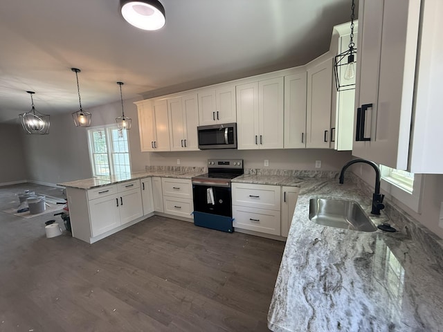 1522 2nd St, Waynesboro, VA 22980 - kitchen featuring stainless steel appliances, a peninsula, white cabinets, and light stone countertops