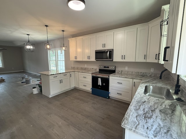 1522 2nd St, Waynesboro, VA 22980 - kitchen with appliances with stainless steel finishes, a peninsula, and white cabinetry