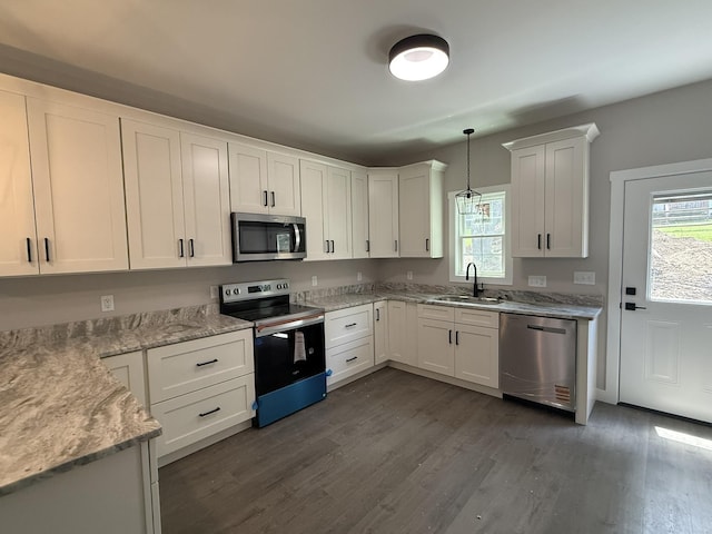 1522 2nd St, Waynesboro, VA 22980 - kitchen featuring appliances with stainless steel finishes, healthy amount of natural light, and white cabinetry