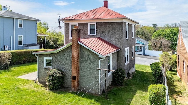 105 Austin Ave, Staunton, VA 24401 - back of house with a standing seam roof, metal roof, a chimney, and stucco siding