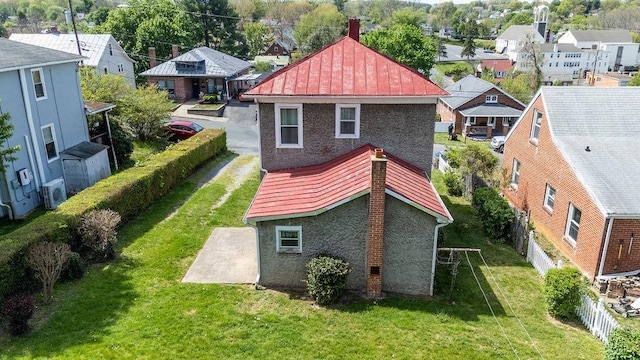 105 Austin Ave, Staunton, VA 24401 - back of house with a residential view, a standing seam roof, a patio, a chimney, and stucco siding