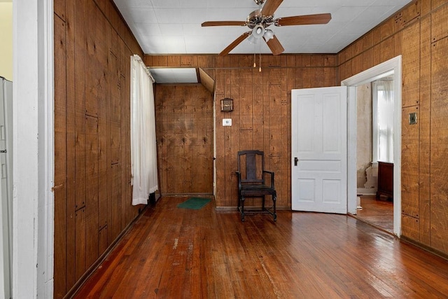 105 Austin Ave, Staunton, VA 24401 - spare room featuring wood walls, hardwood / wood-style flooring, and ceiling fan
