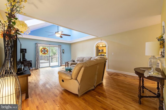 689 Mutton Hollow Rd, Stanardsville, VA 22973 - living area featuring a skylight, baseboards, light wood-style floors, a wood stove, and vaulted ceiling