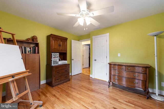 689 Mutton Hollow Rd, Stanardsville, VA 22973 - bedroom with light wood-style flooring, baseboards, and a ceiling fan