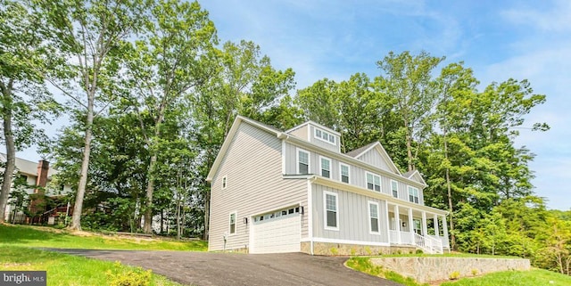 10302 Laurel Ridge Way, Fredericksburg, VA 22408 - view of side of property featuring covered porch, board and batten siding, asphalt driveway, and a garage