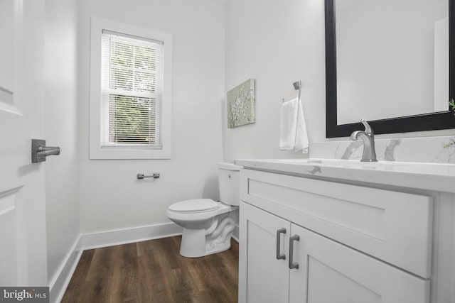 10302 Laurel Ridge Way, Fredericksburg, VA 22408 - half bathroom with baseboards, vanity, wood finished floors, and toilet