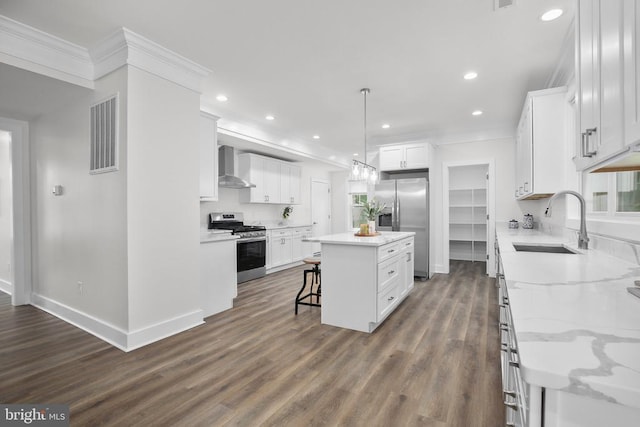 10302 Laurel Ridge Way, Fredericksburg, VA 22408 - kitchen featuring appliances with stainless steel finishes, a sink, a center island, wall chimney range hood, and ornamental molding