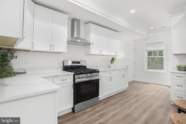 10302 Laurel Ridge Way, Fredericksburg, VA 22408 - kitchen with stainless steel gas range, wall chimney range hood, white cabinets, light wood-style floors, and ornamental molding