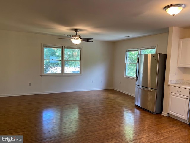 20 Calhoun St N, Warrenton, VA 20186 - kitchen with freestanding refrigerator, white cabinets, dark wood finished floors, light countertops, and a ceiling fan