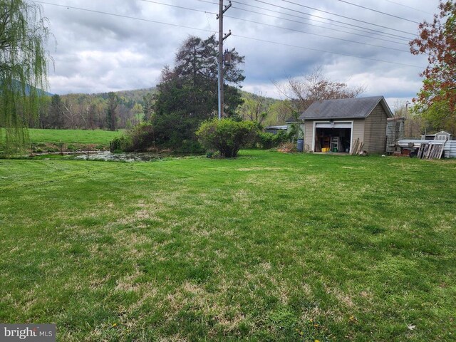 2488 Dry Run Rd, Luray, VA 22835 - view of grassy yard featuring an outdoor structure and a garage