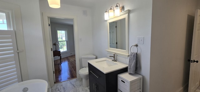242 1st St, Broadway, VA 22815 - bathroom with a soaking tub, marble finish floors, and vanity