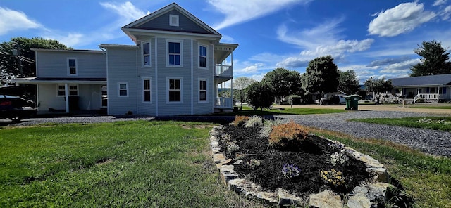 242 1st St, Broadway, VA 22815 - view of front facade featuring a front yard and a balcony