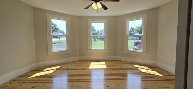 242 1st St, Broadway, VA 22815 - empty room with plenty of natural light, wood finished floors, and ceiling fan