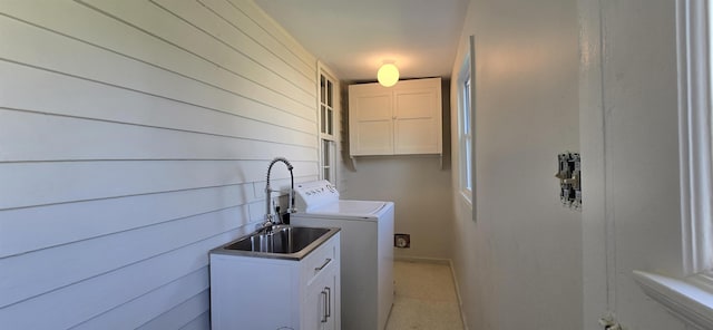 242 1st St, Broadway, VA 22815 - laundry area with washer / clothes dryer, cabinet space, and wooden walls