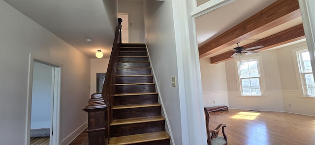 242 1st St, Broadway, VA 22815 - stairway with wood finished floors, beamed ceiling, and a ceiling fan