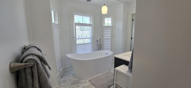 242 1st St, Broadway, VA 22815 - bathroom with marble look tile flooring, a freestanding tub, and vanity