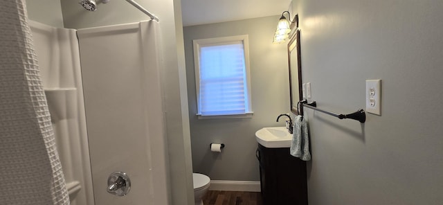 242 1st St, Broadway, VA 22815 - bathroom featuring curtained shower, vanity, and wood finished floors