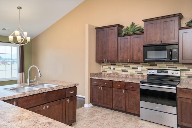 233 Overview St, Waynesboro, VA 22980 - kitchen with black microwave, stainless steel electric range, lofted ceiling, backsplash, and a chandelier