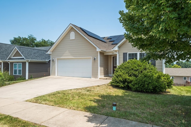 233 Overview St, Waynesboro, VA 22980 - view of front of home featuring a garage, concrete driveway, roof mounted solar panels, a front lawn, and a shingled roof