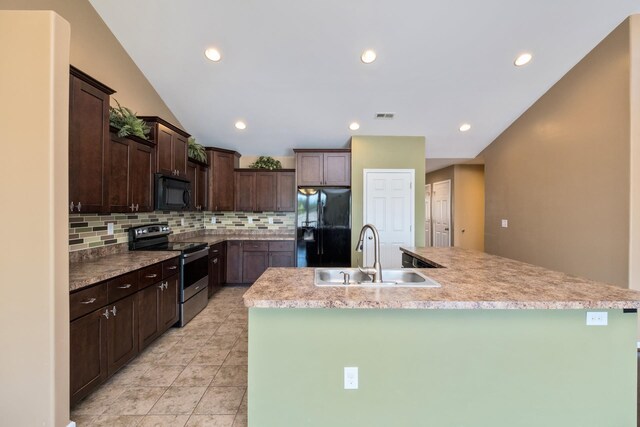 233 Overview St, Waynesboro, VA 22980 - kitchen featuring black appliances, dark brown cabinets, a kitchen island with sink, backsplash, and recessed lighting