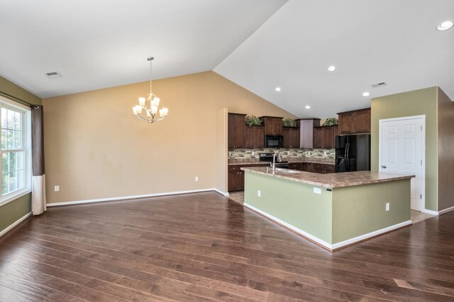 233 Overview St, Waynesboro, VA 22980 - kitchen featuring black appliances, a large island, a chandelier, lofted ceiling, and dark brown cabinetry