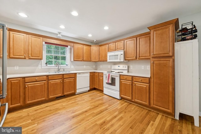 102 Oak Knoll Pl, Bumpass, VA 23024 - kitchen featuring white appliances, light wood finished floors, light countertops, brown cabinets, and recessed lighting