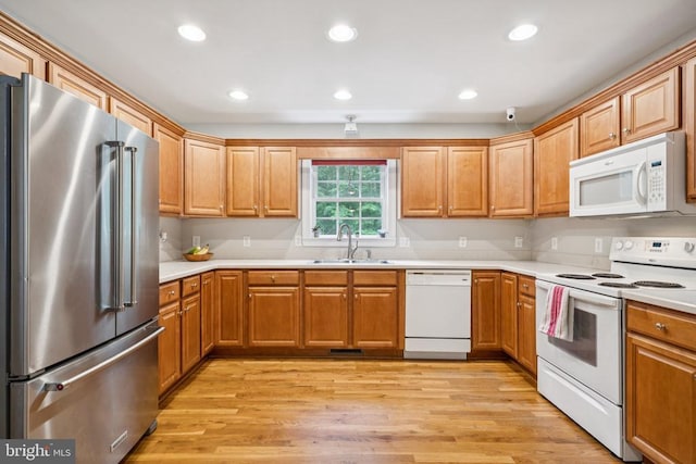 102 Oak Knoll Pl, Bumpass, VA 23024 - kitchen featuring white appliances, light countertops, recessed lighting, and light wood-style flooring