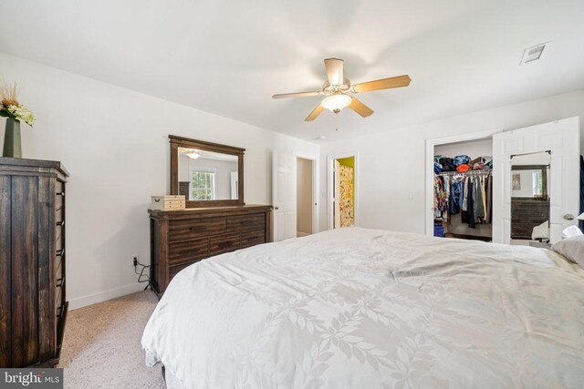 102 Oak Knoll Pl, Bumpass, VA 23024 - bedroom with light colored carpet, a spacious closet, and a ceiling fan