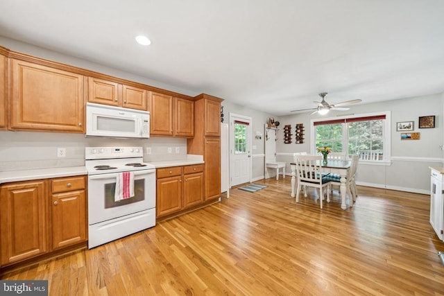102 Oak Knoll Pl, Bumpass, VA 23024 - kitchen with white appliances, light countertops, healthy amount of natural light, light wood-style flooring, and recessed lighting