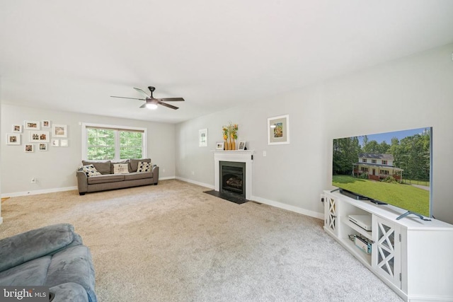 102 Oak Knoll Pl, Bumpass, VA 23024 - carpeted living room with ceiling fan and a fireplace with flush hearth