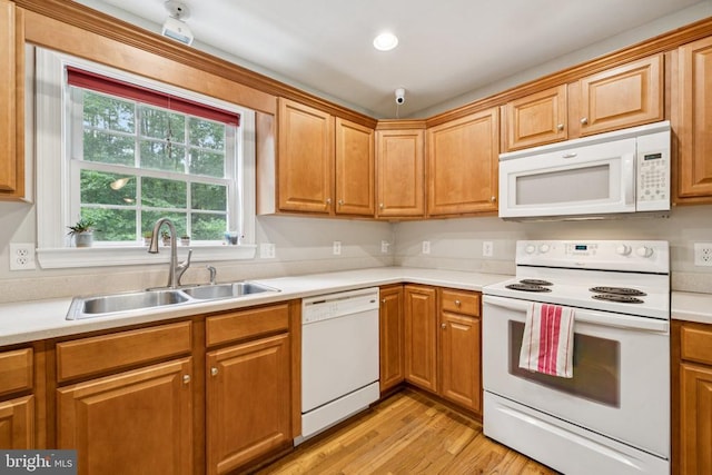 102 Oak Knoll Pl, Bumpass, VA 23024 - kitchen with white appliances, light wood-type flooring, light countertops, and brown cabinets