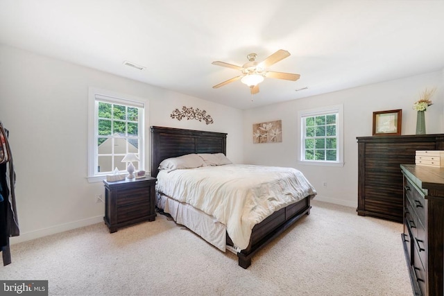 102 Oak Knoll Pl, Bumpass, VA 23024 - bedroom with multiple windows, light colored carpet, and ceiling fan