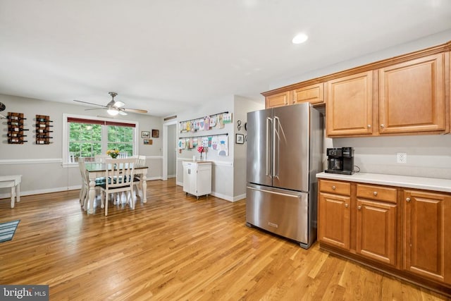 102 Oak Knoll Pl, Bumpass, VA 23024 - kitchen featuring high end fridge, ceiling fan, light wood finished floors, light countertops, and brown cabinets