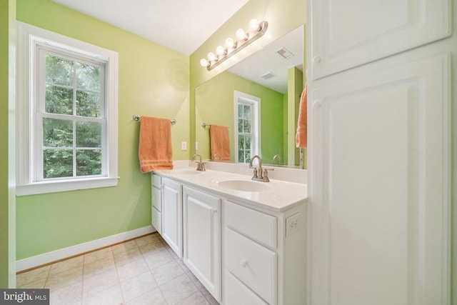 102 Oak Knoll Pl, Bumpass, VA 23024 - bathroom featuring healthy amount of natural light, double vanity, and tile patterned floors