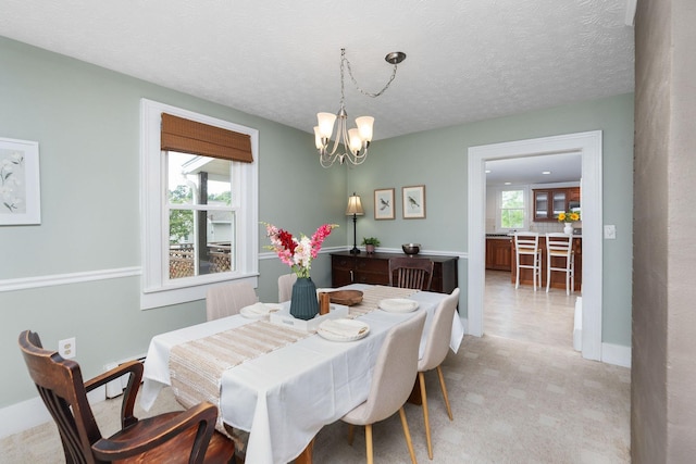 199 Hermitage Rd, Staunton, VA 24401 - dining space featuring a chandelier, healthy amount of natural light, light carpet, baseboards, and a textured ceiling
