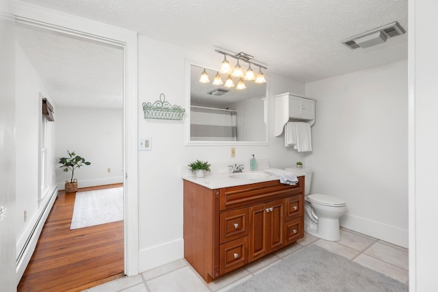 199 Hermitage Rd, Staunton, VA 24401 - full bath with a baseboard radiator, vanity, toilet, baseboards, and curtained shower