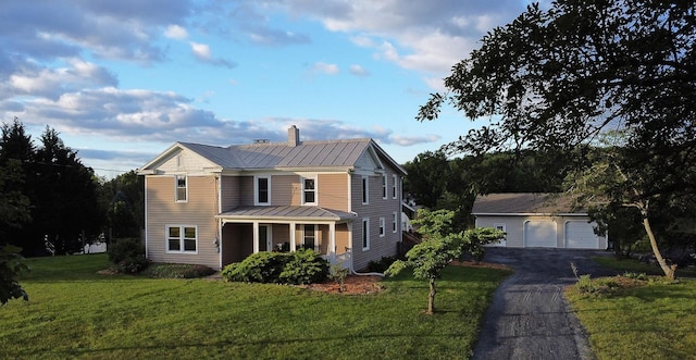 199 Hermitage Rd, Staunton, VA 24401 - view of front of home featuring metal roof, a front yard, a chimney, a garage, and a standing seam roof