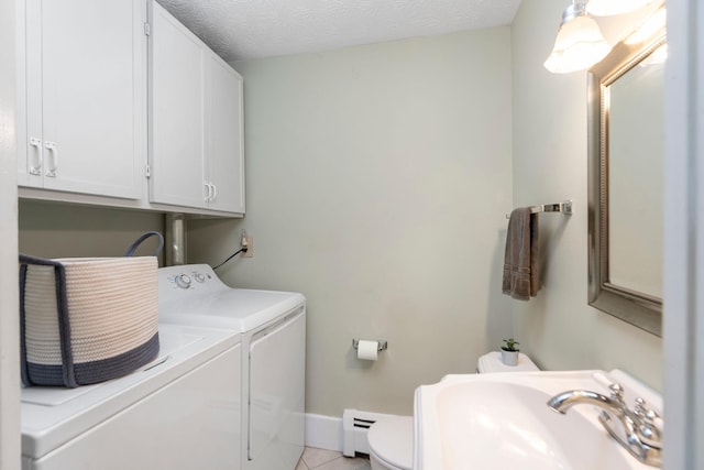 199 Hermitage Rd, Staunton, VA 24401 - laundry area featuring washer and dryer, a sink, a baseboard radiator, light tile patterned floors, and baseboards
