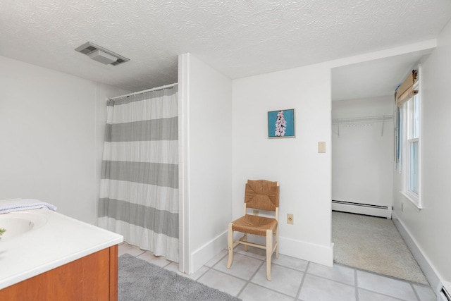 199 Hermitage Rd, Staunton, VA 24401 - bathroom featuring baseboard heating, vanity, tile patterned floors, a shower with curtain, and a textured ceiling