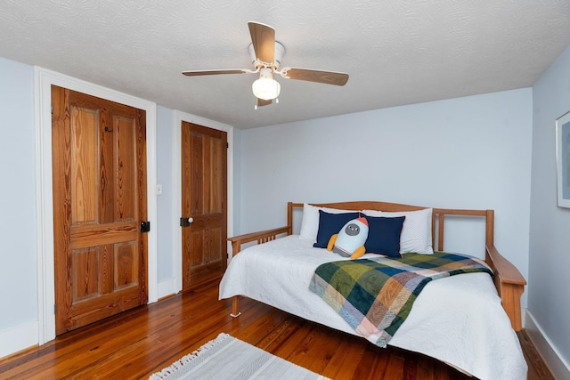 199 Hermitage Rd, Staunton, VA 24401 - bedroom featuring wood finished floors, a textured ceiling, baseboards, and ceiling fan