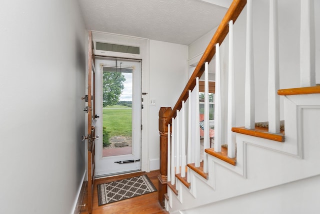 199 Hermitage Rd, Staunton, VA 24401 - entrance foyer with stairs, wood finished floors, baseboards, and a textured ceiling
