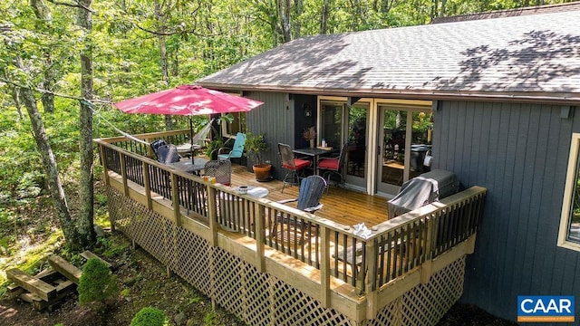 127 Blackrock Cir, Roseland, VA 22967 - wooden deck featuring outdoor dining space and a view of trees