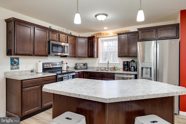 147 Fishermans Ln, Luray, VA 22835 - kitchen featuring appliances with stainless steel finishes, a sink, dark brown cabinets, and light countertops