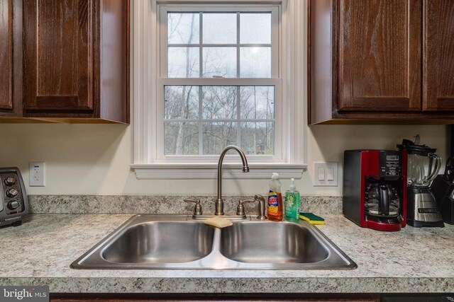 147 Fishermans Ln, Luray, VA 22835 - kitchen featuring a sink, light countertops, and dark brown cabinetry