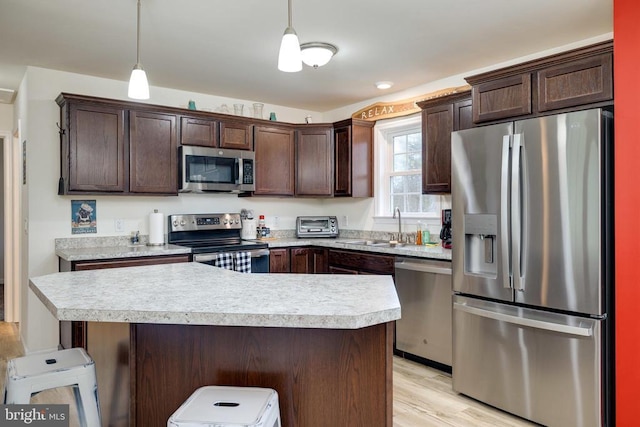 147 Fishermans Ln, Luray, VA 22835 - kitchen with appliances with stainless steel finishes, a sink, dark brown cabinets, and light countertops