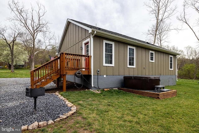147 Fishermans Ln, Luray, VA 22835 - view of side of property featuring a hot tub, board and batten siding, a deck, a lawn, and stairway