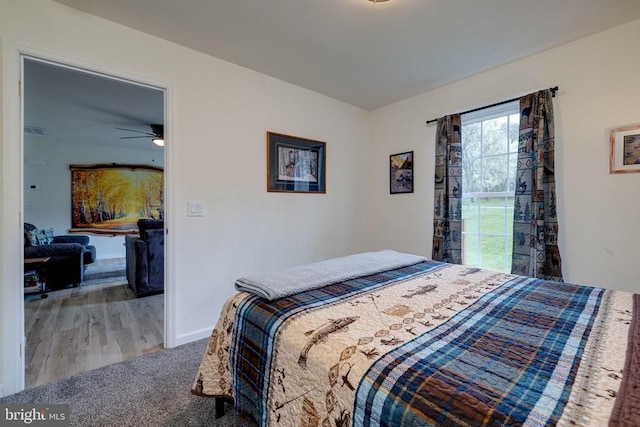 147 Fishermans Ln, Luray, VA 22835 - carpeted bedroom with baseboards and wood finished floors