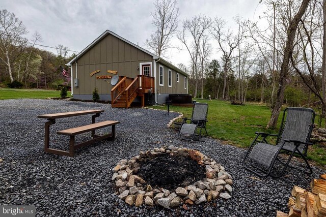 147 Fishermans Ln, Luray, VA 22835 - back of property featuring an outdoor fire pit, board and batten siding, and a yard